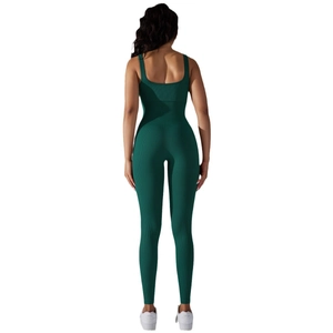 Deep green seamless ribbed jumpsuit for yoga with open back and bodycon athletic fit