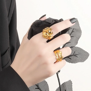 Chic irregular gold rings with pleated texture and thorn design worn on hands