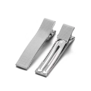 Detail view of grey grosgrain ribbon wrapped metal alligator clips from both sides