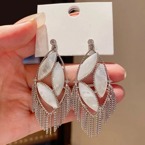 Silver hollow oval tassel earrings with white marquise stone and long fringe drop chains