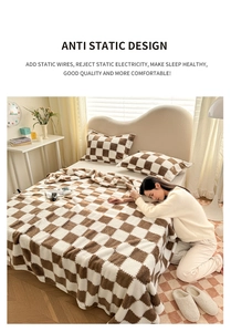 Detail of brown and white checkered plush blanket featuring anti-static conductive fibers