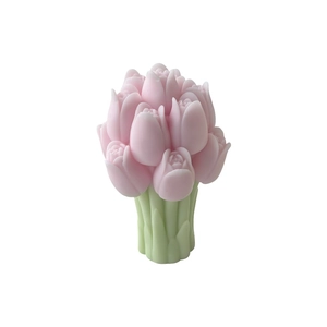 Pink tulip flower bouquet candle with green base on a clean white background