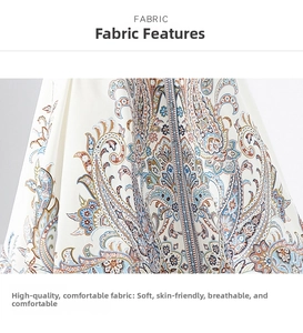Detail of paisley print fabric on ivory dress showing intricate floral patterns