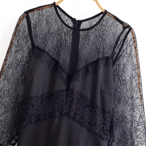 Elegant black lace patchwork dress with long sleeves and refined satin fabric details