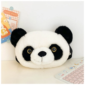 Detailed close-up of a large plush panda head tote bag on a minimalist desk setup