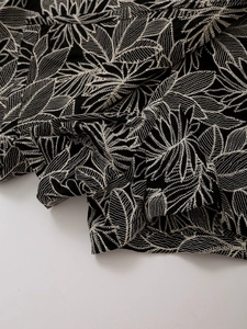 Close-up of high-quality leaf embroidery texture on elegant high-waisted shorts skirt