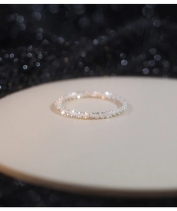 Macro detail of S925 sterling silver ring featuring a sparkling textured starry surface