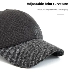Detail of adjustable curved brim on men's thermal tweed baseball cap with ear flaps