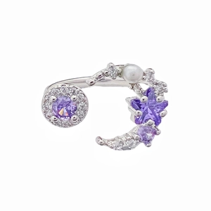 Silver open ring with purple zircon star and moon design featuring white pearl detail