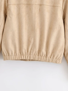 Detailed close-up of khaki faux suede jacket featuring elastic hem and vertical seam work