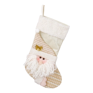 Golden knitted Christmas stocking with Santa Claus character for holiday tree decoration