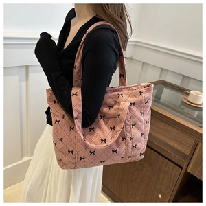 Sac fourre-tout en velours côtelé rose avec motif nœud noir et surpiqûres