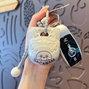 Light blue silicone car key cover with 3D Sacabambaspis fish relief and matching strap