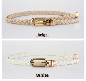 Close-up of beige and white braided PU leather belts with gold metal buckles