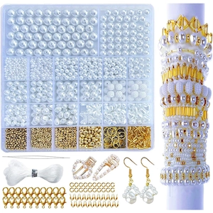 DIY jewelry making kit with white pearls, gold charms and 24-grid storage box