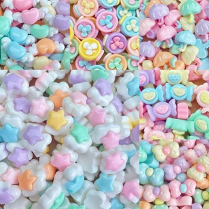 Mix of mini resin DIY charms in macaron colors including candy and umbrella shapes