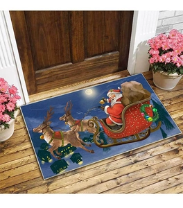 Detail of Christmas doormat with Santa Claus sleigh scene on a wooden porch