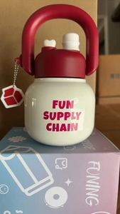 Close-up of a white and red insulated water bottle with handle and Funing logo
