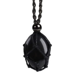 Macro view of hand-woven black cord mesh wrapping a polished obsidian gemstone pendant