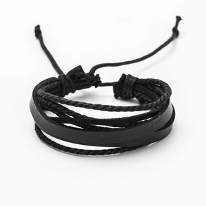 Detail of multi-layer black leather bracelet with braided cords and adjustable knot