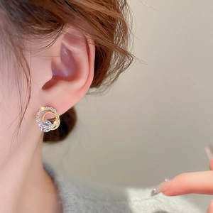 Elegant gold plated double circle earrings with sparkling cubic zirconia on model