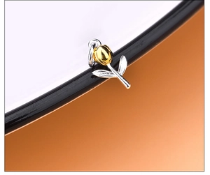 Macro shot of 925 silver tulip pendant featuring dual-tone gold and silver finish
