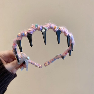Close-up of multicolor knit yarn headband with non-slip sawtooth grip for women