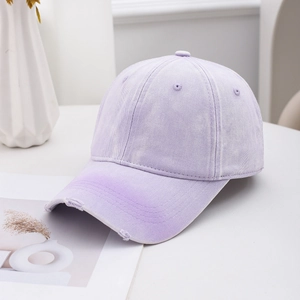 Vintage washed purple denim baseball cap with distressed brim and retro street style design