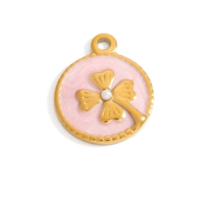 Macro view of gold round pendant featuring pink enamel, clover motif and white pearl inlay
