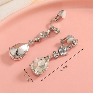 Detail shot of silver crystal leaf earrings with 5.4cm length and 1.5cm width specs