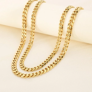 Close-up of golden stainless steel Cuban chain necklace with high polish finish