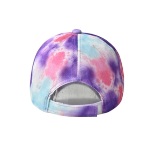 Detail of tie-dye sun visor hat with adjustable velcro strap and breathable cotton fabric