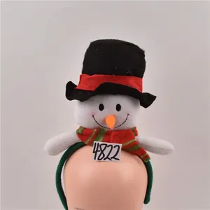 Detail of Christmas snowman headband with top hat and plush carrot nose for party decor