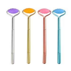 Pressure-relief gel pens with massage rollers in four metallic colors on white background
