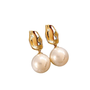 Minimalist pearl drop earrings with gold irregular metal studs on a white background