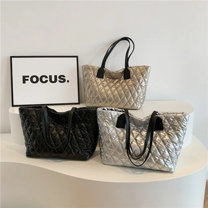Quilted tote bags in metallic gold, black, and silver finishes with elegant diamond stitching