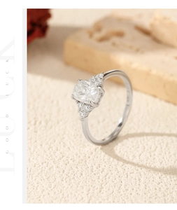 Detailed macro view of a 1-carat cushion-cut moissanite stone on a 925 silver ring