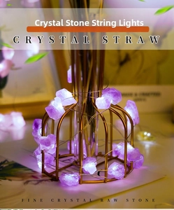 Macro view of natural amethyst raw stone LED string lights on a gold metal frame