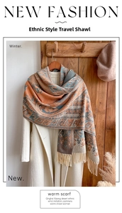 Ethnic style paisley scarf with long tassels paired with a white coat and beret