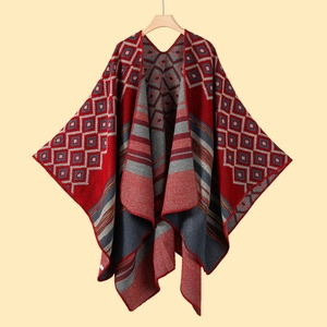 Detail of knit shawl featuring geometric diamond patterns in red, grey and navy blue