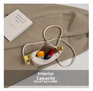Detail view of cream white kids handbag showing interior capacity for phone and cosmetics