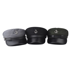 Three nautical baker boy hats in grey, black, and green with leather visors and metal anchors