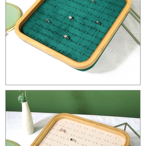Bamboo jewelry tray with green velvet slots for rings and earrings display