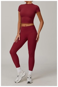 Detailed view of high-elasticity dark red two-piece yoga set with cropped top and leggings