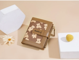 Detailed view of brown PU leather wallet featuring cute bear print and secure snap closure