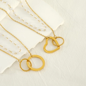 Double-layer gold stainless steel necklace with heart pendant and delicate white pearls