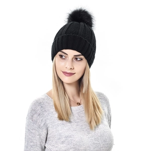 Detailed knit texture and fluffy faux fur pompom on this cozy black winter beanie hat