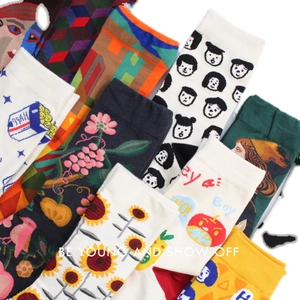 Vibrant unisex cotton socks with floral, geometric, and artistic patterns in various colors
