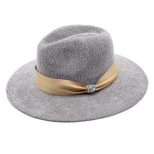 Detail of grey chenille fedora hat featuring ribbed texture and sparkly buckle ribbon