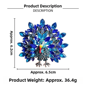 Peacock crystal brooch with blue rhinestones measuring 6.2cm by 6.5cm on white background
